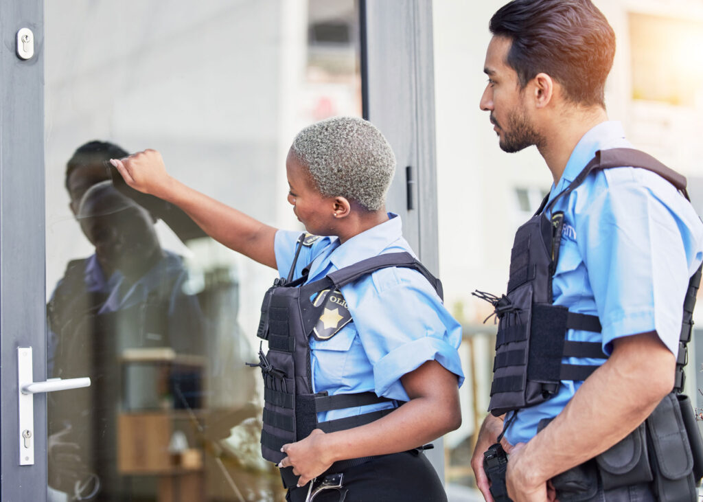 two police officers knocking on the door at your home